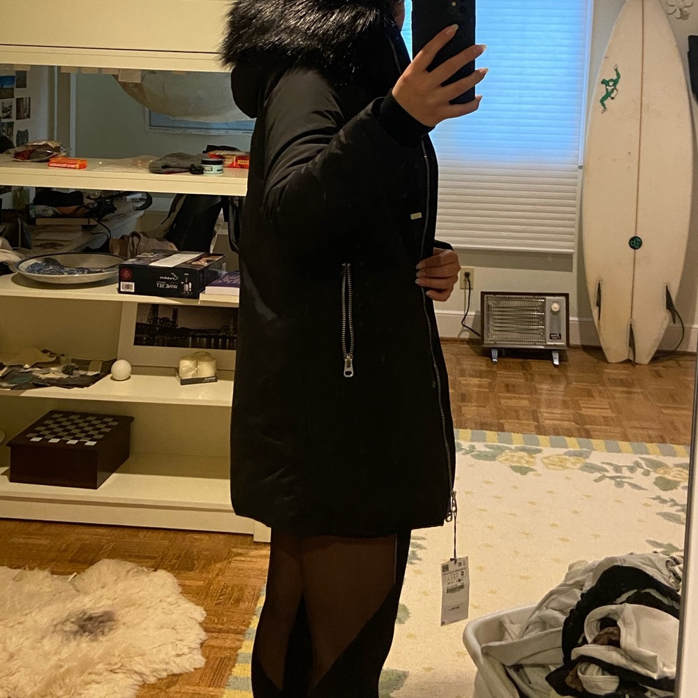 Black soft winter coat. Never worn with tags.